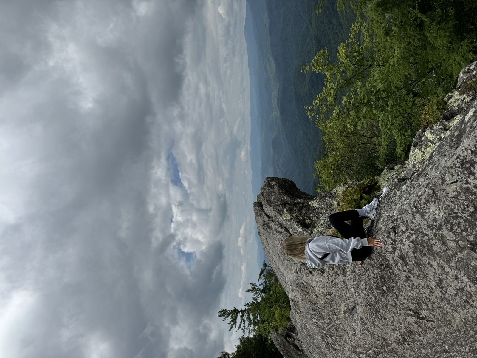 Sitting on The Blowing Rock overlooking the mountains